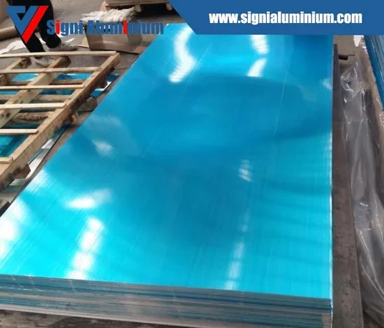 A stack of bright aluminium sheets covered with blue protective film