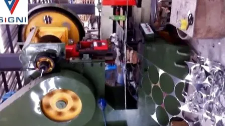 A blanking line punching aluminium circles from strip, with punched skeleton strip on the right