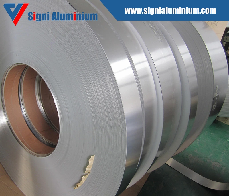 Close view of several bright aluminium strip coils for fin stock