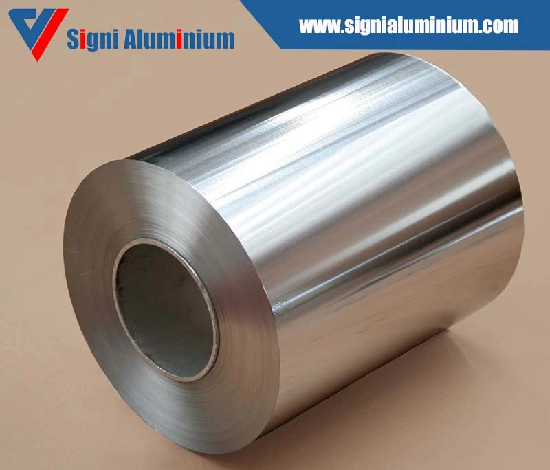 A single bright aluminium foil roll with a cardboard core on a plain background
